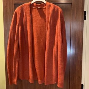 Burnt orange cardigan.